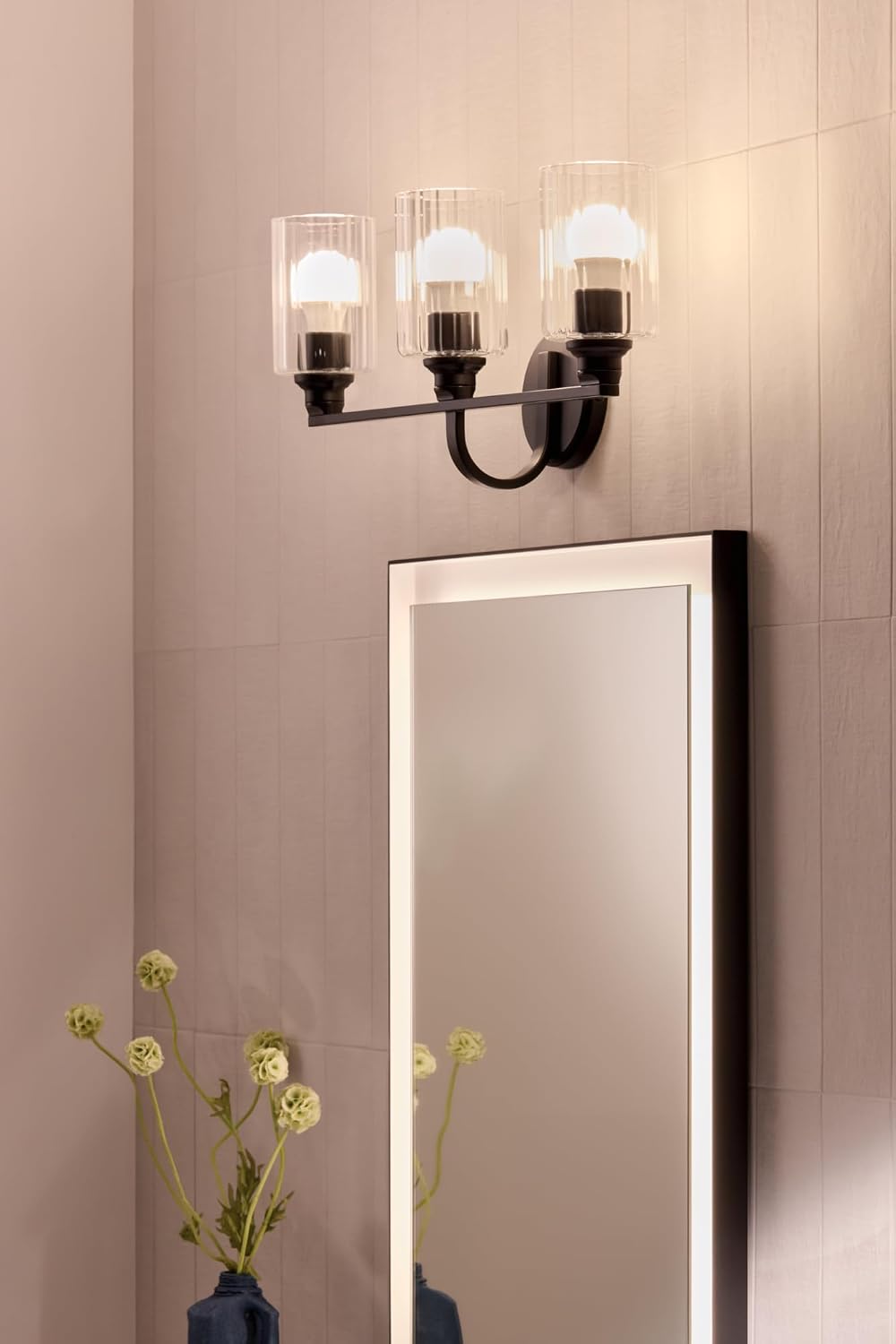 Kichler Gioe 24.25' 3-Light Bathroom Vanity Light Fixture with Clear Fluted Glass in Black, Modern Wall Mount Over Mirror for Powder Room, Damp Rated (24.25' W x 10.5' H), 55226BKFLU