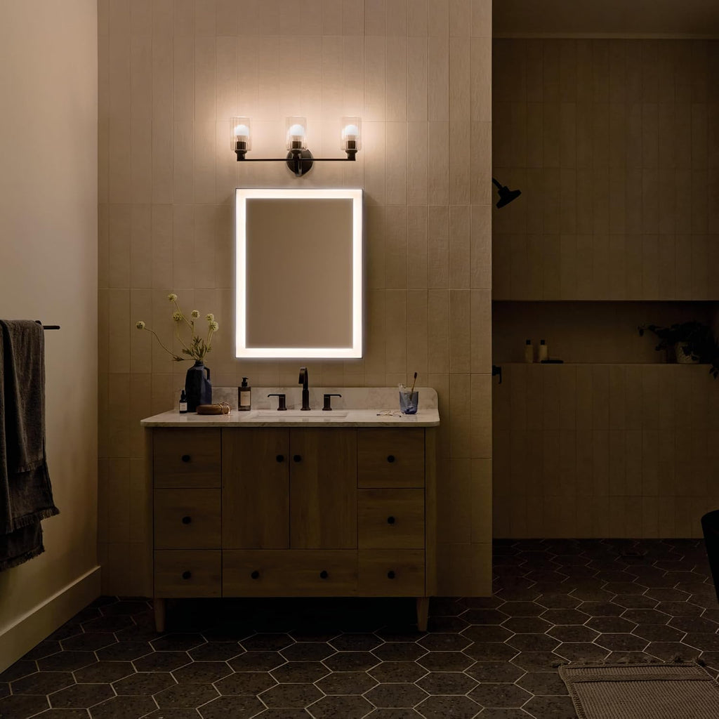 Kichler Gioe 24.25' 3-Light Bathroom Vanity Light Fixture with Clear Fluted Glass in Black, Modern Wall Mount Over Mirror for Powder Room, Damp Rated (24.25' W x 10.5' H), 55226BKFLU