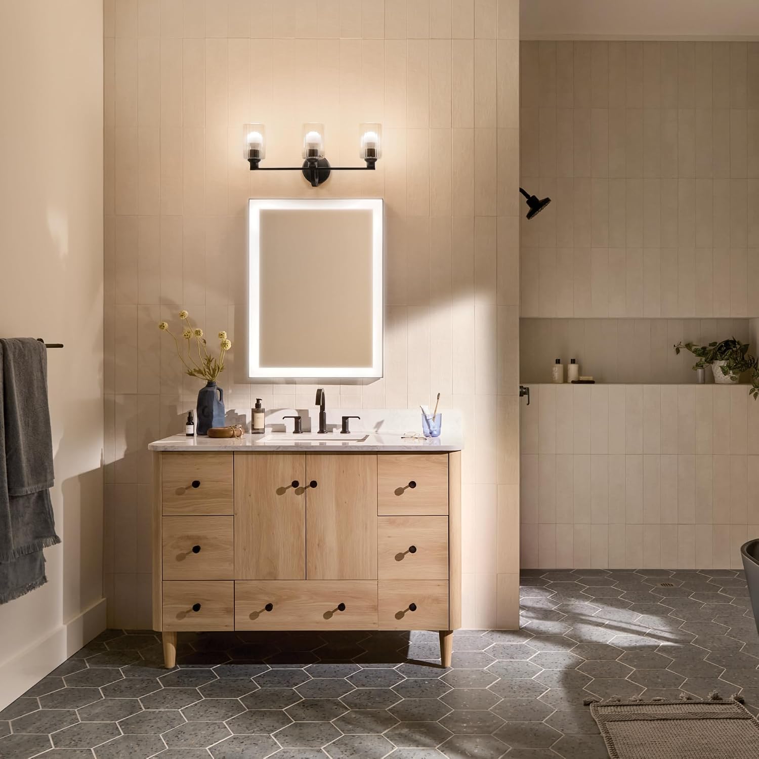 Kichler Gioe 24.25' 3-Light Bathroom Vanity Light Fixture with Clear Fluted Glass in Black, Modern Wall Mount Over Mirror for Powder Room, Damp Rated (24.25' W x 10.5' H), 55226BKFLU